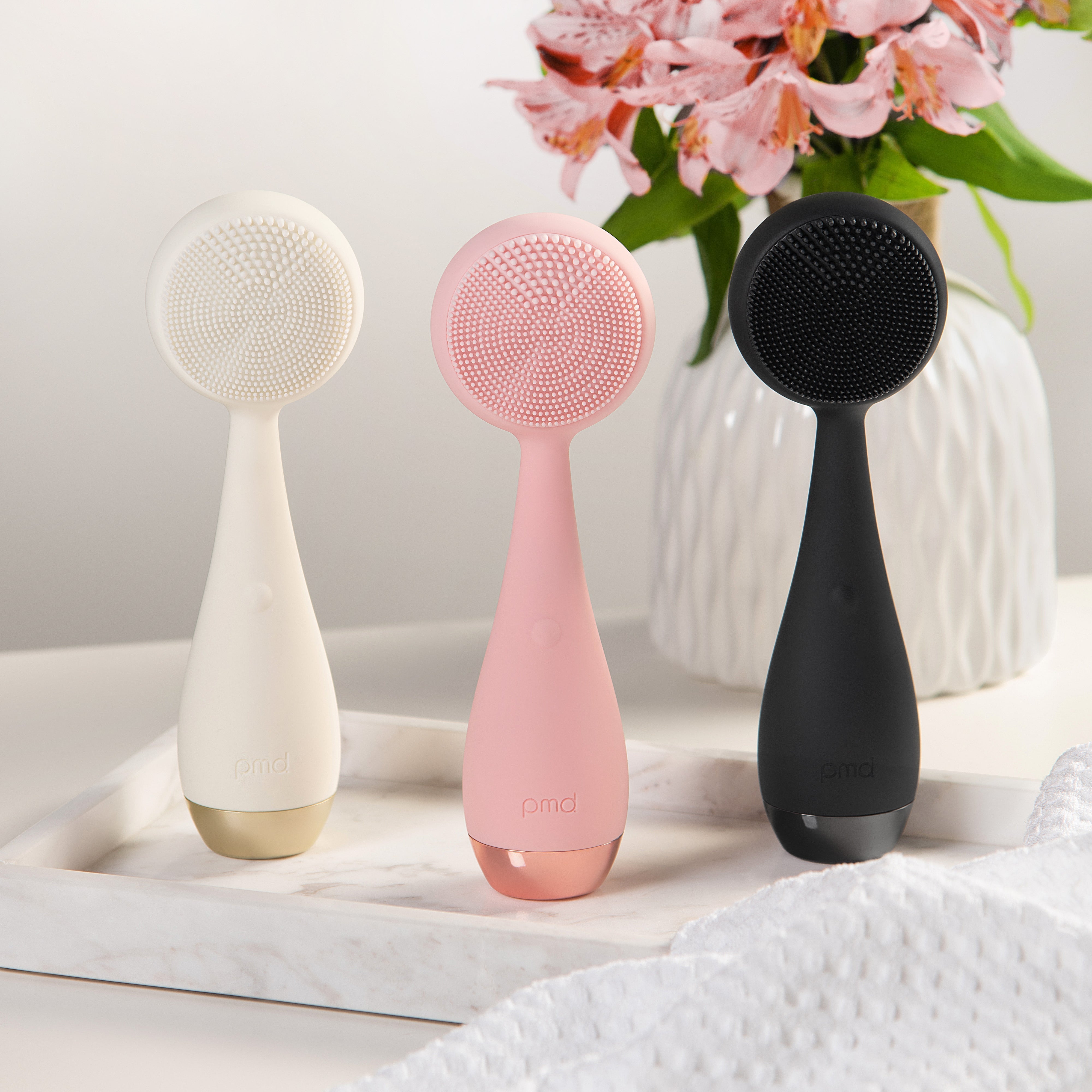 PMD Beauty Clean devices lineup, showing three models of the Clean Pro facial cleansing tools designed for deep pore cleansing, gentle exfoliation, and glowing skin.