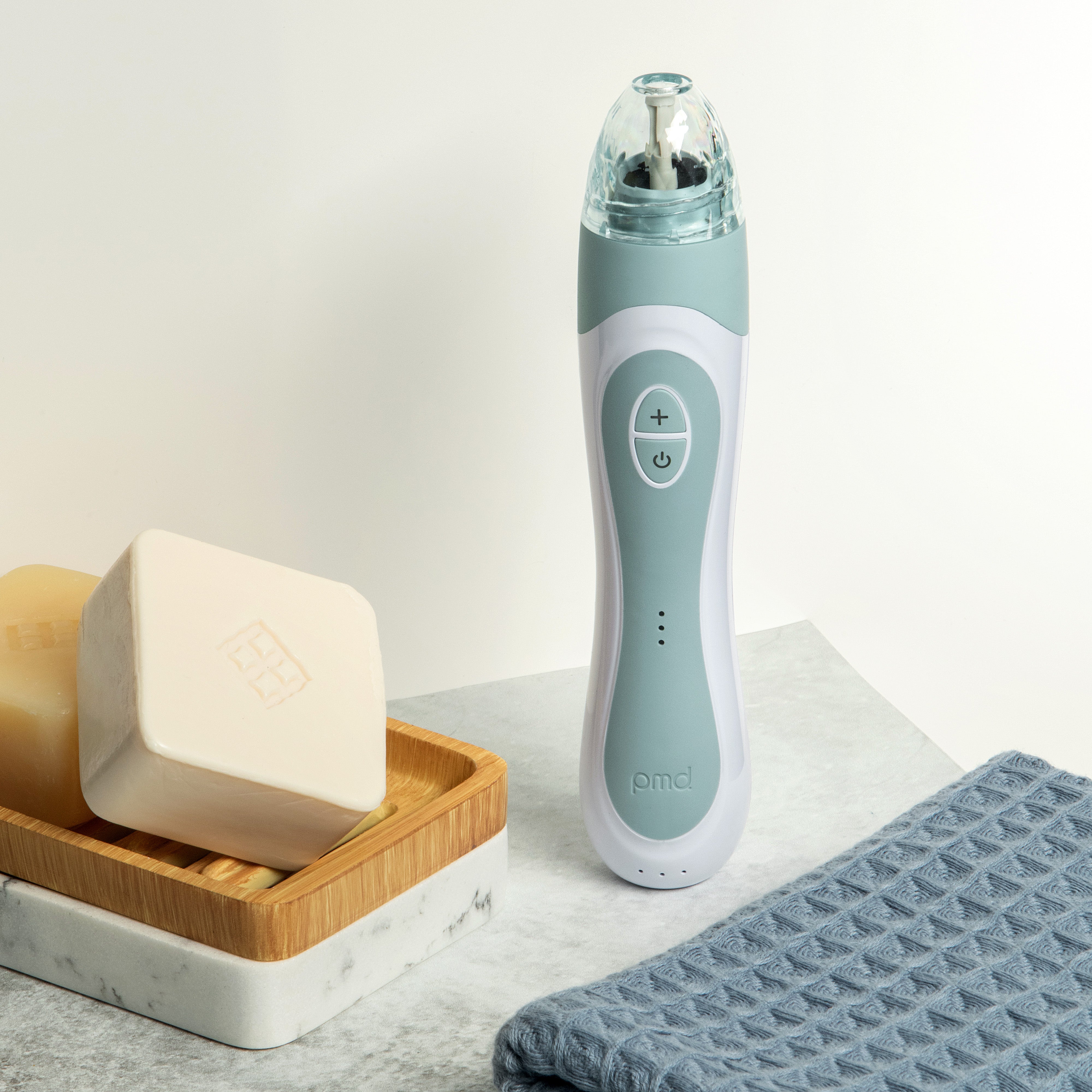 PMD Beauty Personal Microderm Elite Pro at-home microdermabrasion device with 3 luxe caps, 3 speed settings, 3 suction options, and cordless rechargeable design for professional-level skin exfoliation and radiant skin.