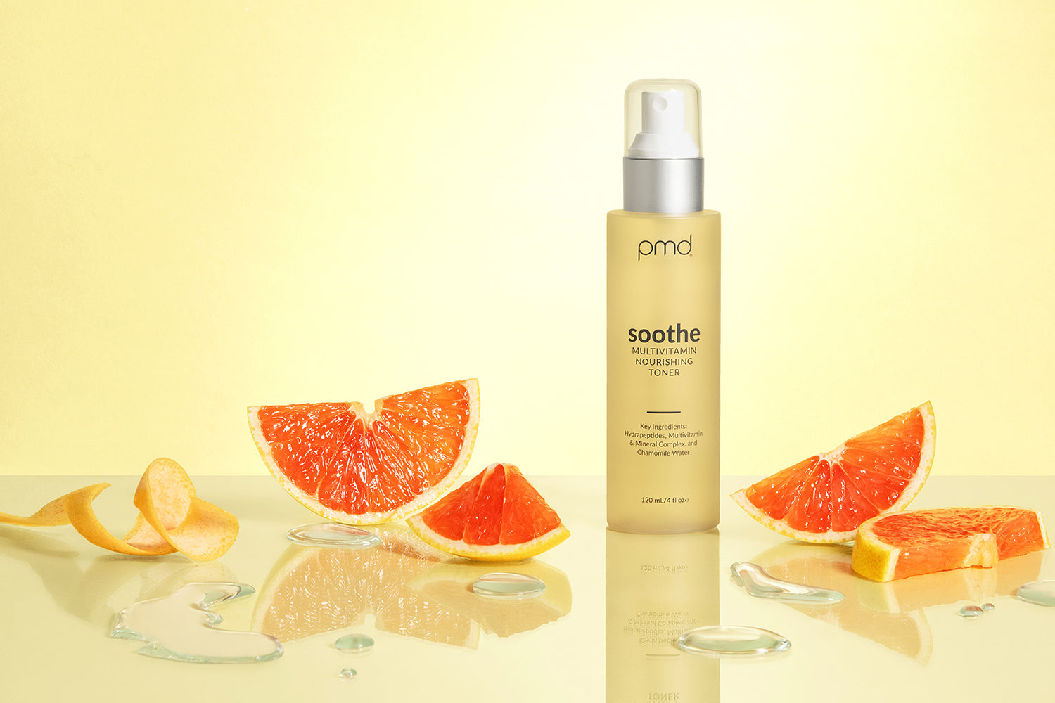 toner on yellow background surrounded by citrus