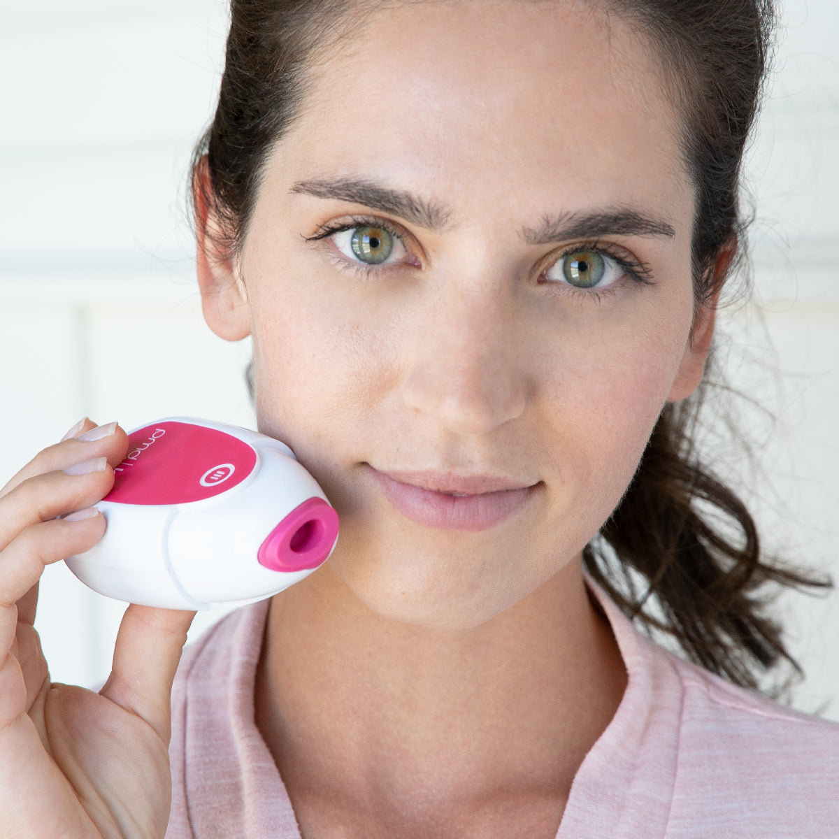 woman holding PMD Kiss