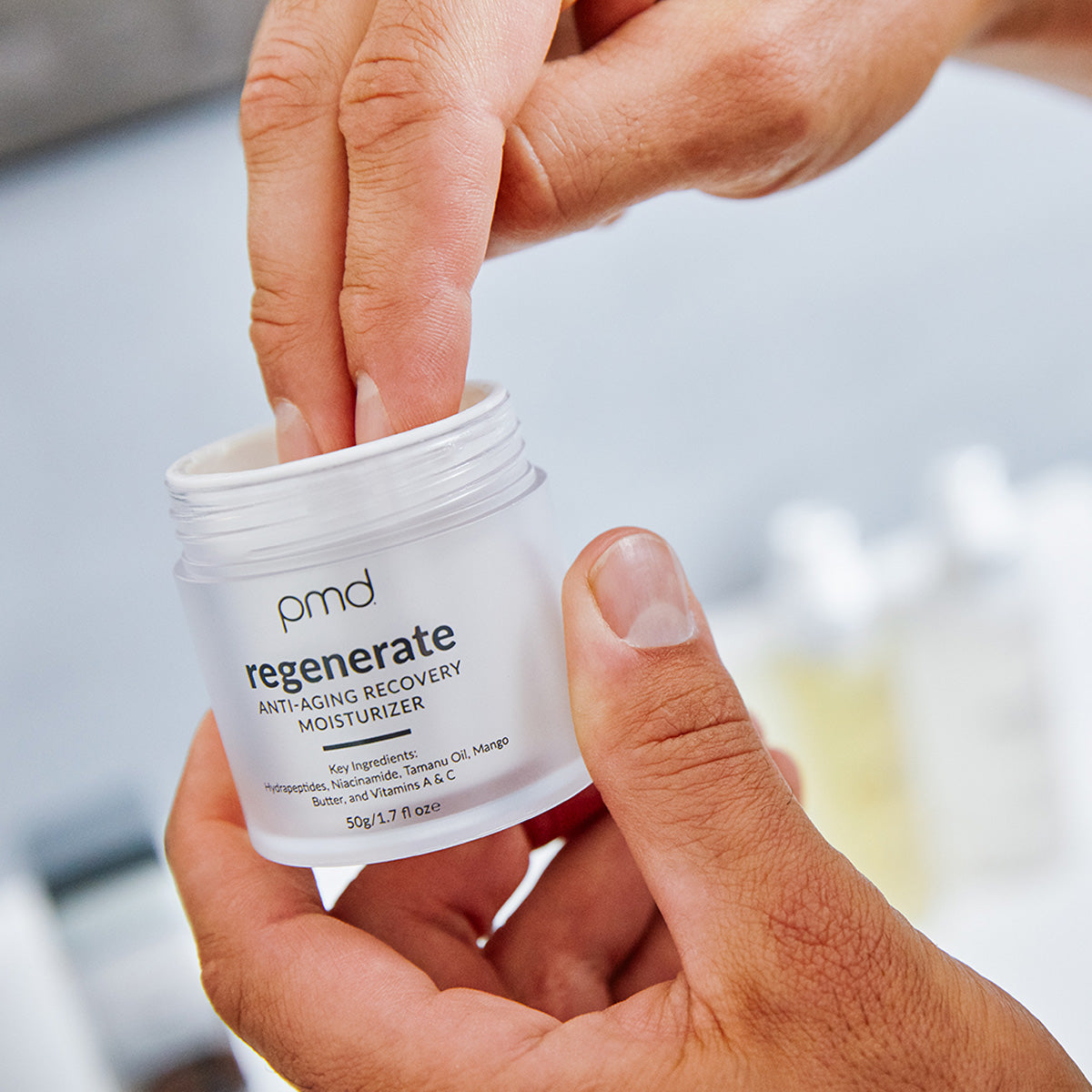 man applying moisturizer to Clean Pro