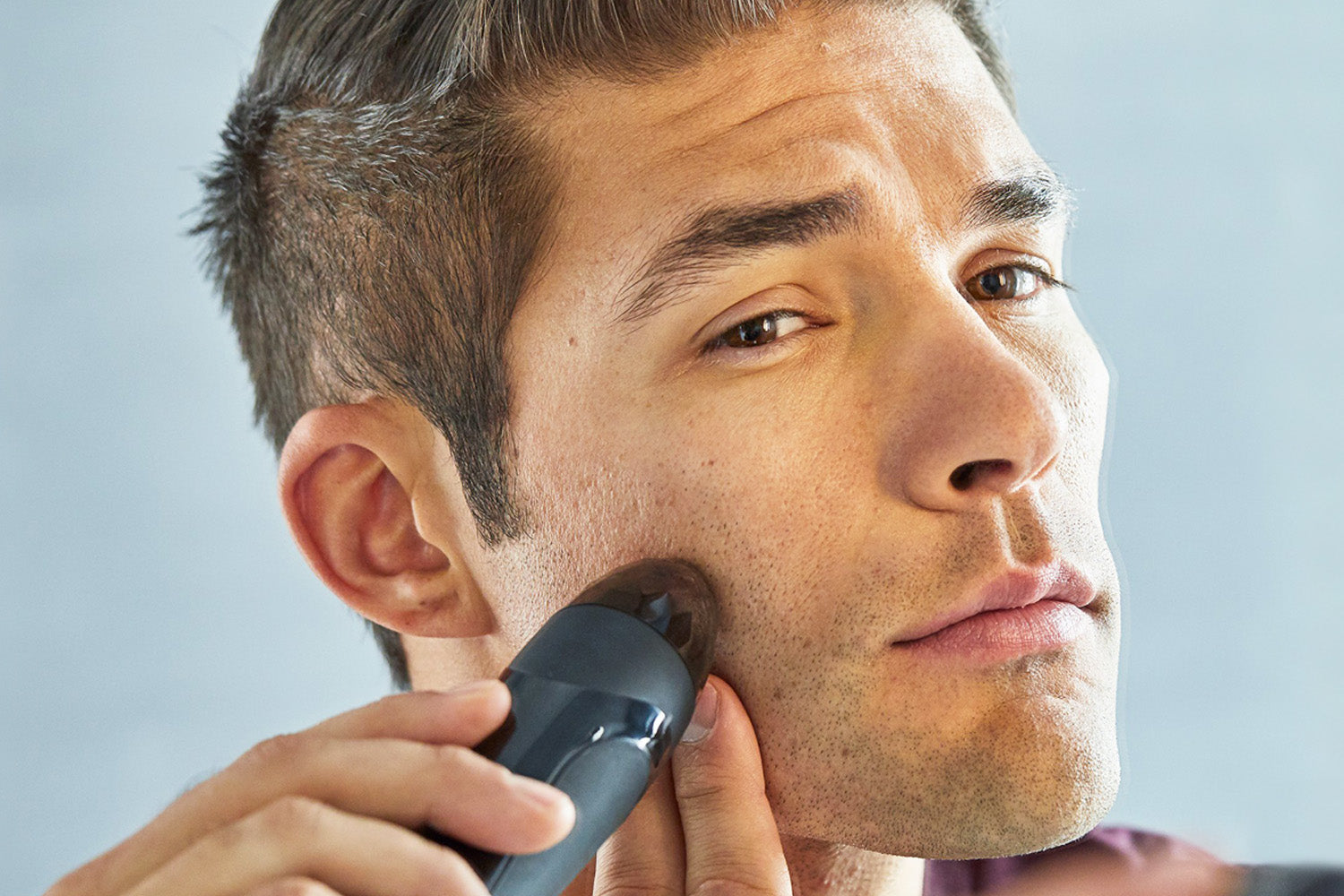 man using personal microderm elite pro