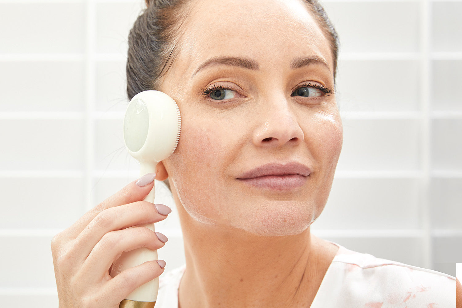 woman using PMD Clean Pro Jade