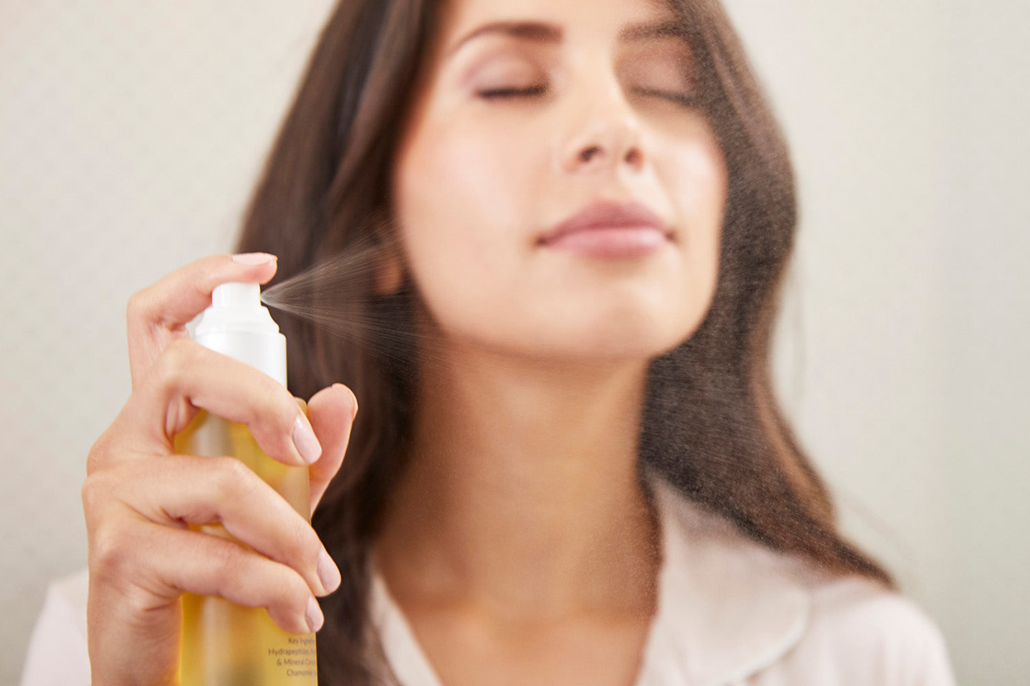 women spraying soothe