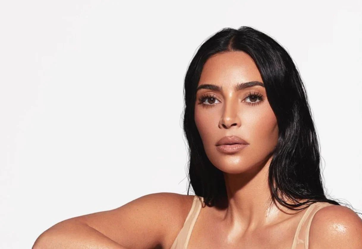 Kim Kardashian with radiant, glowing skin, showing the results of using PMD products