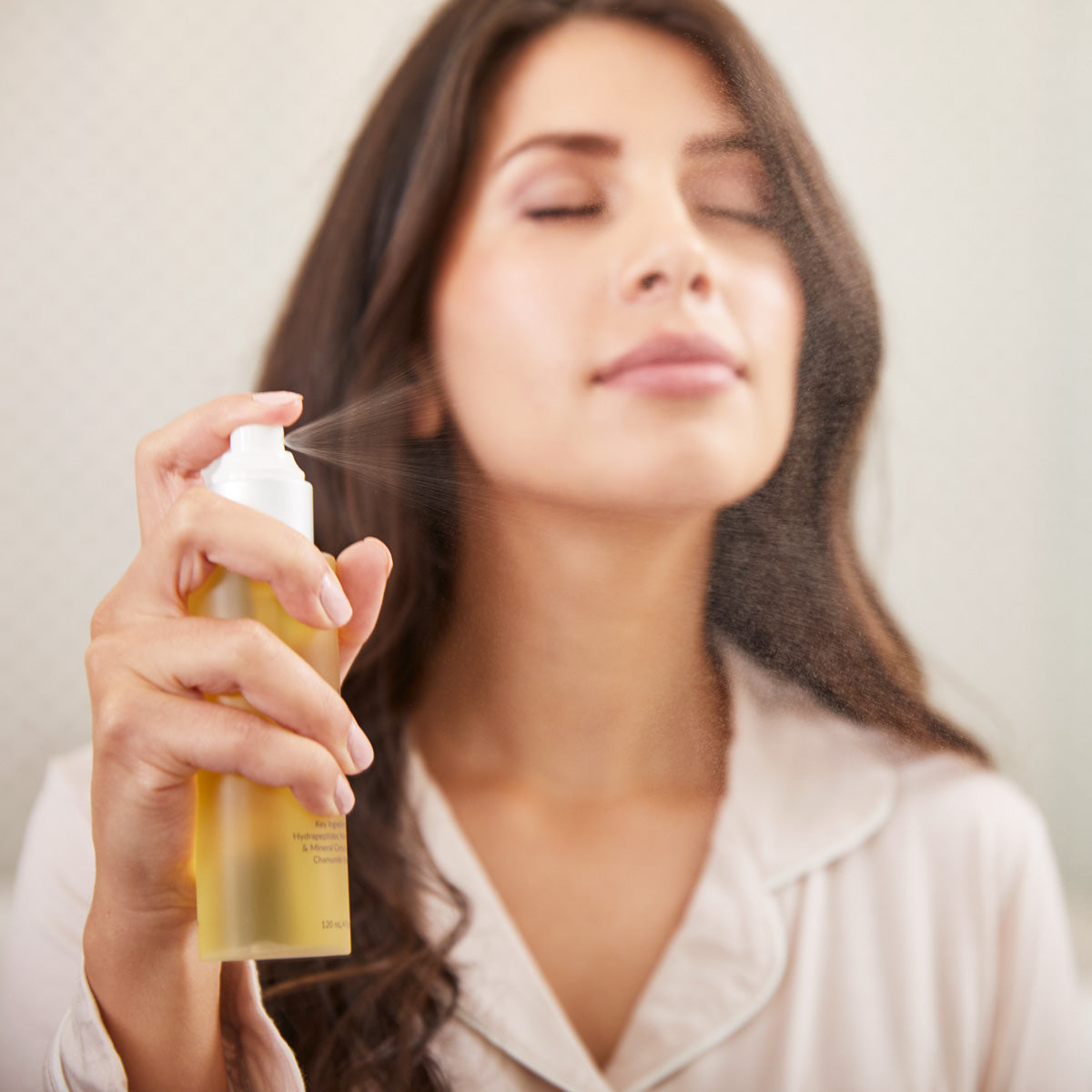 woman spraying toner