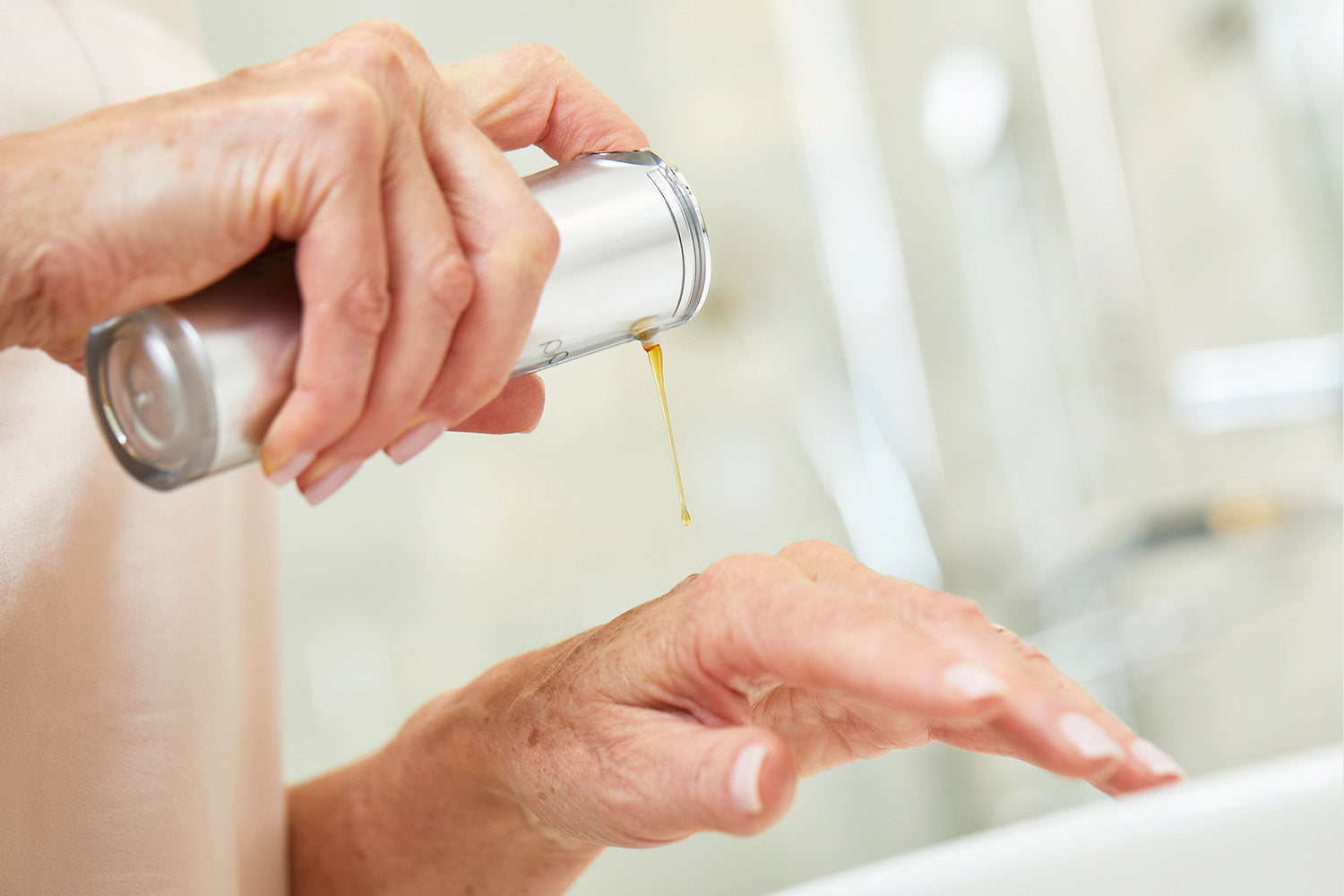 woman using refinish on her hands