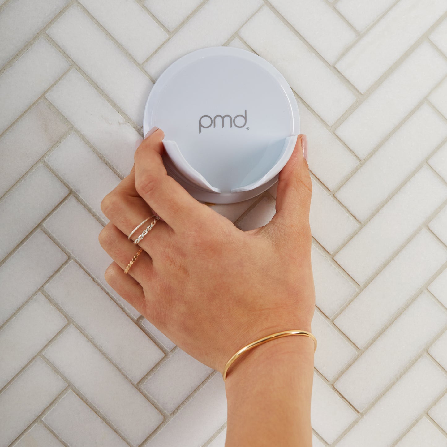 hover-image?Woman holding PMD Clean Body Shower Holder