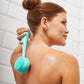 AT-4003-MTEAL? Woman using PMD Clean Body in teal to massage back