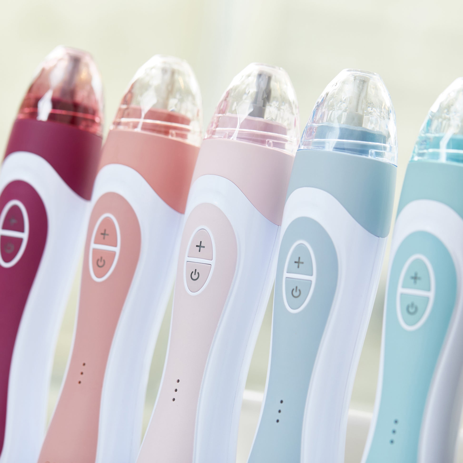 1005-berry?Personal Microderm Elite Pro's standing next to eachother