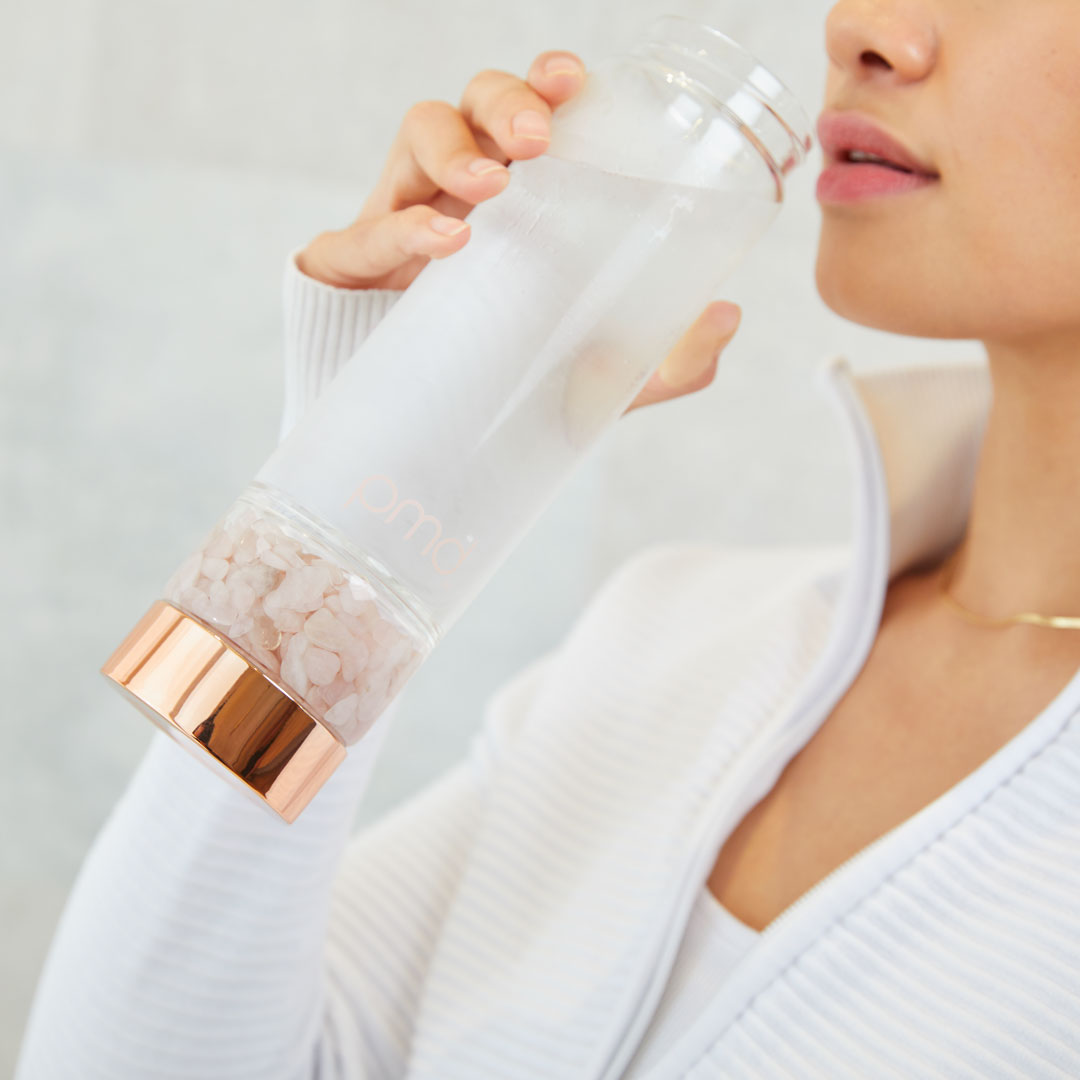 5012-RQ?Woman sipping from PMD Aqua Water Bottle