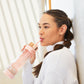 5012-KIT-RQ?Woman sipping from PMD Aqua Water Bottle with Accessories
