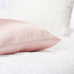 449270?Closeup of silversilk pillowcase in rose on bed