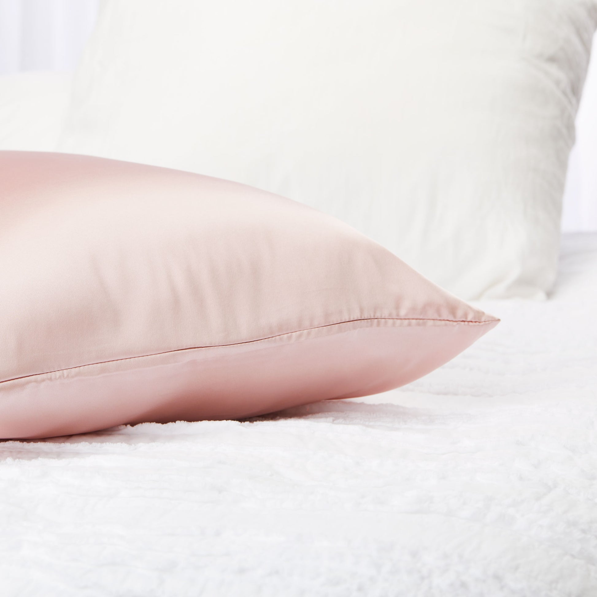 5008-PCROSE?Closeup of silversilk pillowcase in rose on bed