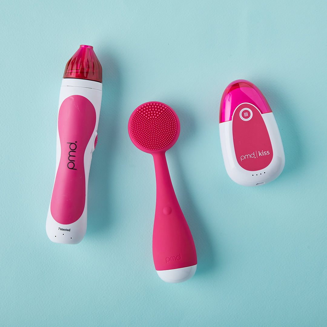 1001-Pink?Personal Microderm Classic in Pink, PMD Kiss in Pink, & PMD Clean in Pink on blue background