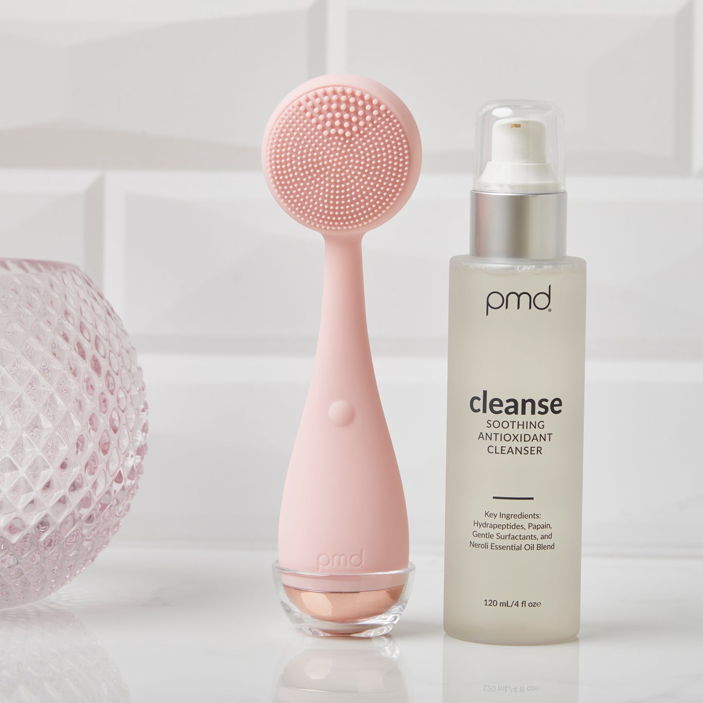 1021-N?cleanse Soothing Antioxidant Cleanser on a counter with a blush PMD Clean