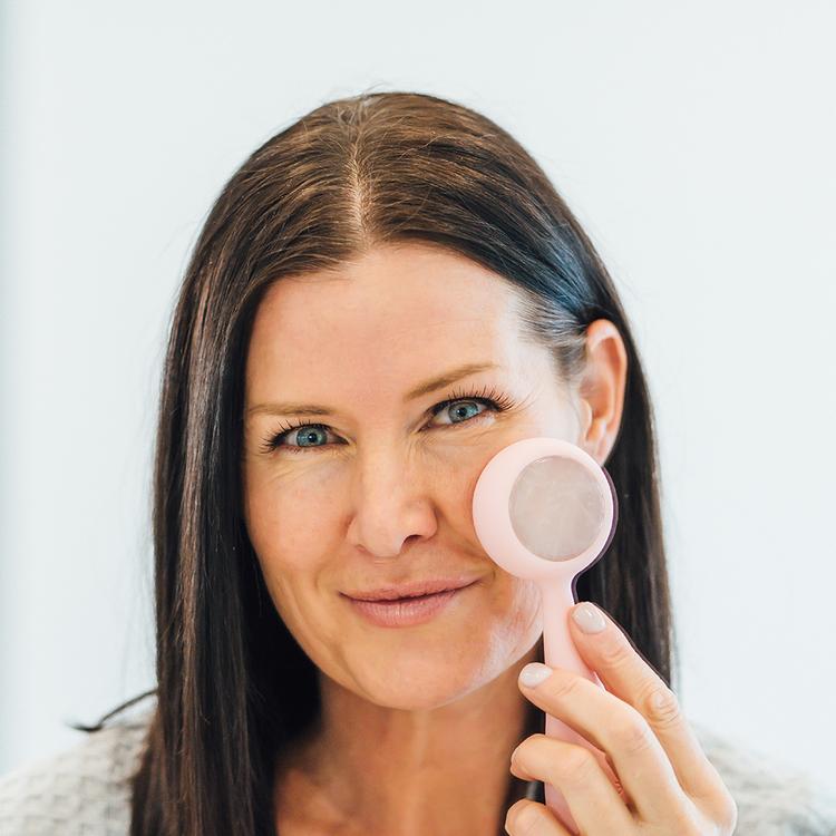 hover-image?Woman using blush PMD