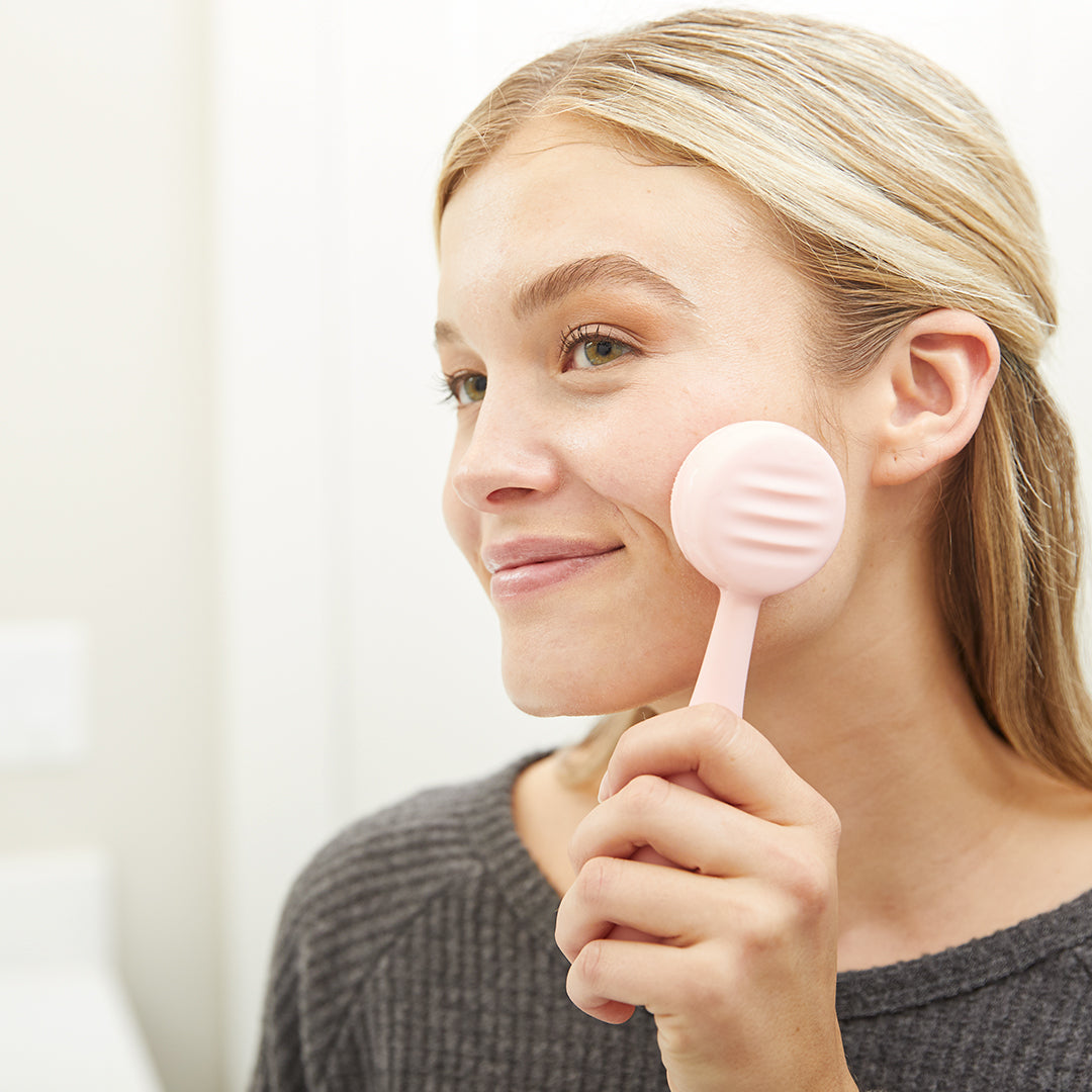 4001-Blush? Woman using blush PMD Clean to wash her face
