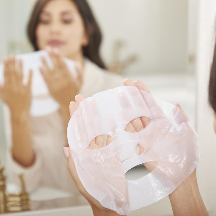 fresh_face_classic_bundle_pink?Woman holding recovery sheet mask