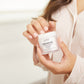 1023-N?Woman using fingers to apply regenerate Anti-Aging Recovery Moisturizer