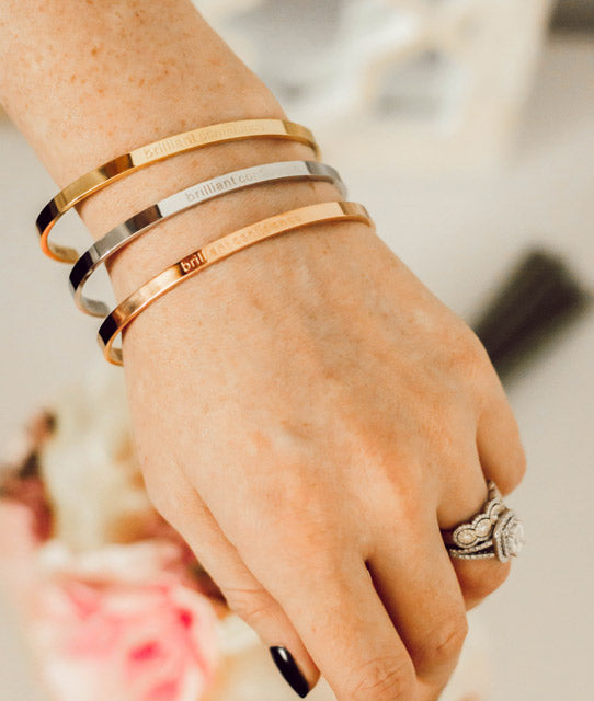 5006-Gold?Woman with Brilliant Confidence Bracelets stacked on wrist